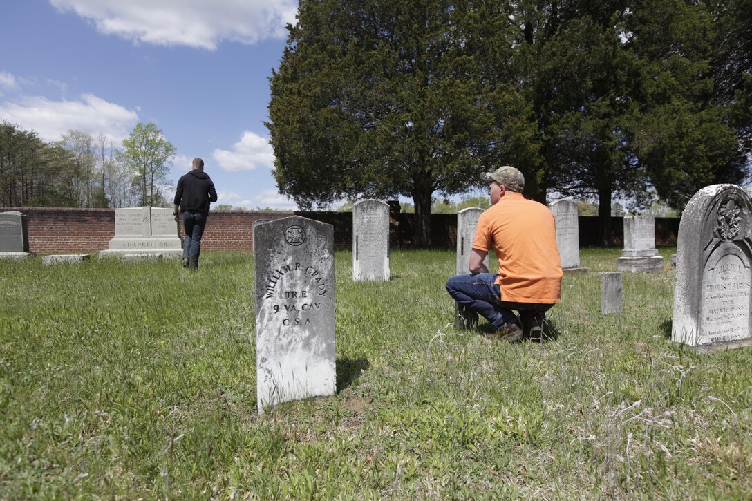 Cpl. Bradley Geib reads the headstones in an old cemetery during a trip to the Chancellorsville Battlefield in Virginia April 23, 2015. Geib is an administrative noncommissioned officer in charge with the Center for Naval Aviation and Technical Training at Marine Corps Air Station Cherry Point, North Carolina.