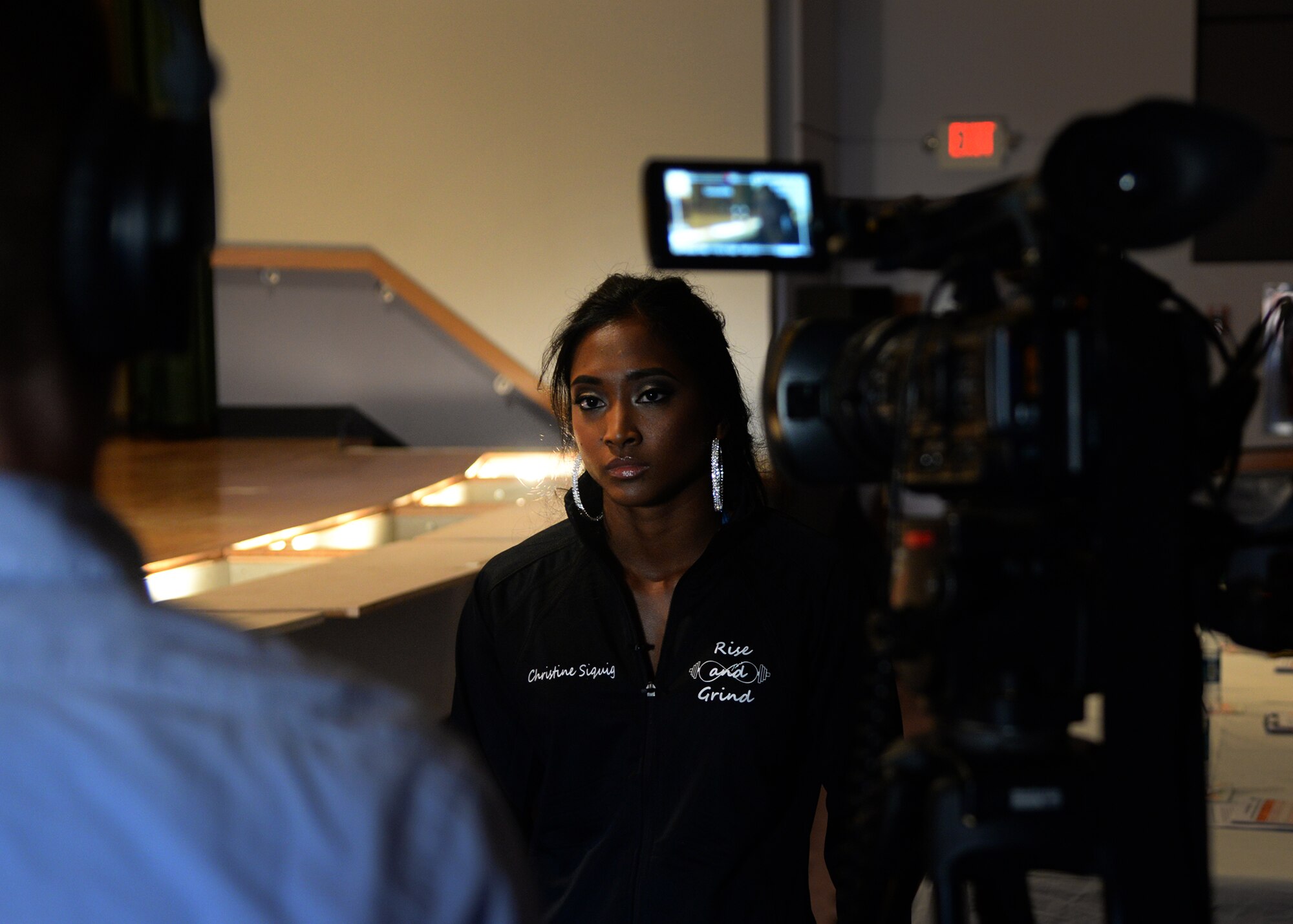 U.S. Air Force Senior Airman Christine Siquig, 27th Special Operations Force Support Squadron personal readiness technician, is interviewed before the commencement of the Cannon Classic April 25, 2015 at Cannon Air Force Base, N.M. The event was the first of its kind for Air Commandos at Cannon and was a huge success. (U.S. Air Force photo/Airman 1st Class Chip Slack)