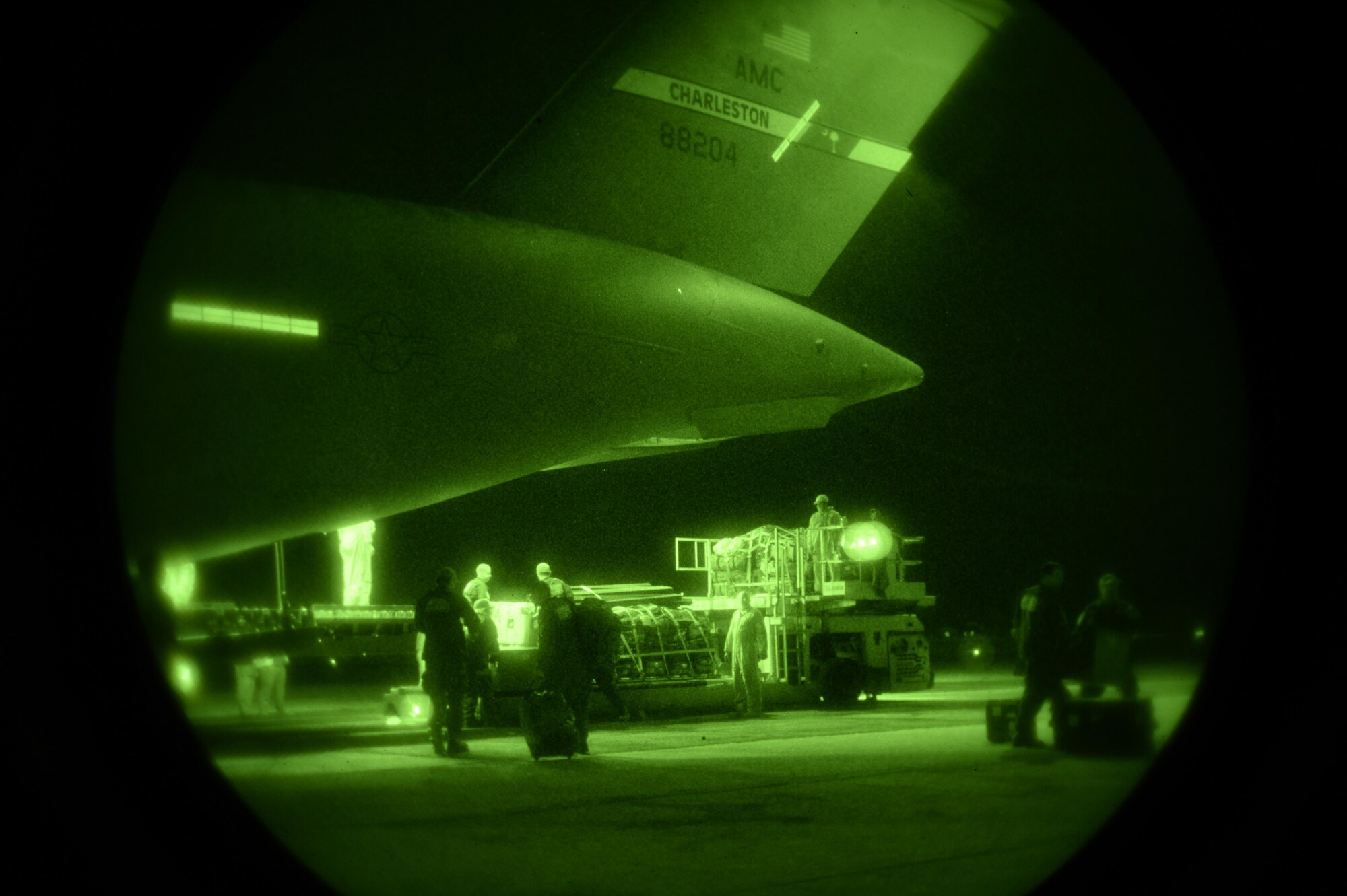 U.S. Air Force Airmen offload relief supplies for victims of the Nepal earthquake from a USAF C-17 Globemaster III April 28, 2015. The Air Force transported relief supplies along with members of the United States Agency to International Development (USAID), the Los Angeles County Search and Rescue team and five search and rescue dogs to Katmandu, Nepal. (U.S. Air Force photo/Airman 1st Class Taylor Queen)