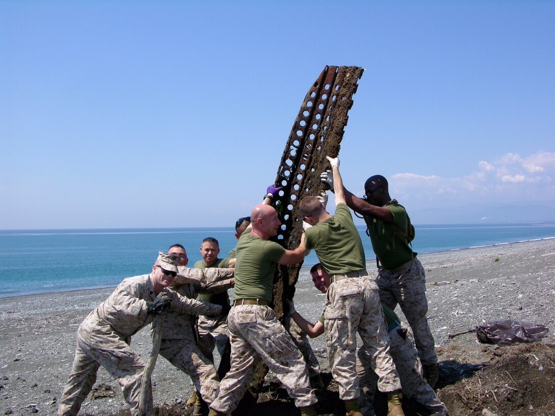 Marines, sailors, and civilians from CATC Camp Fuji conducted a clean-up of the Marine Corps training area at Numazu Beach in commemoration of Earth Day, Thursday April 23, 2015.