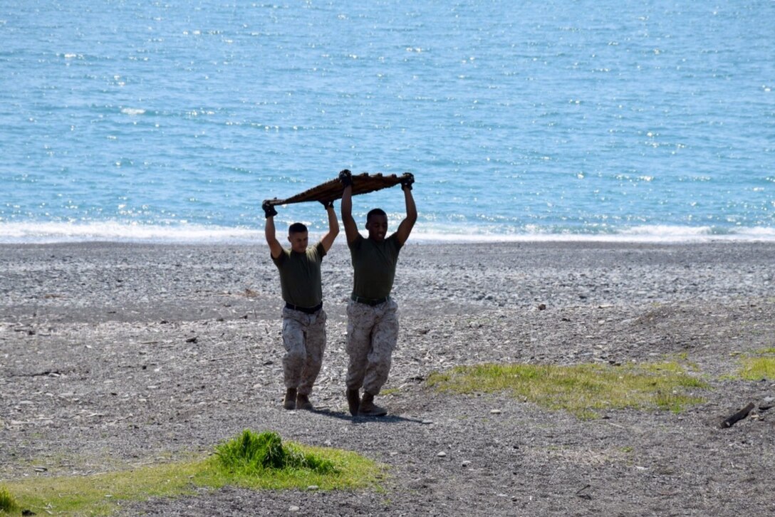 Marines, sailors, and civilians from CATC Camp Fuji conducted a clean-up of the Marine Corps training area at Numazu Beach in commemoration of Earth Day, Thursday April 23, 2015.