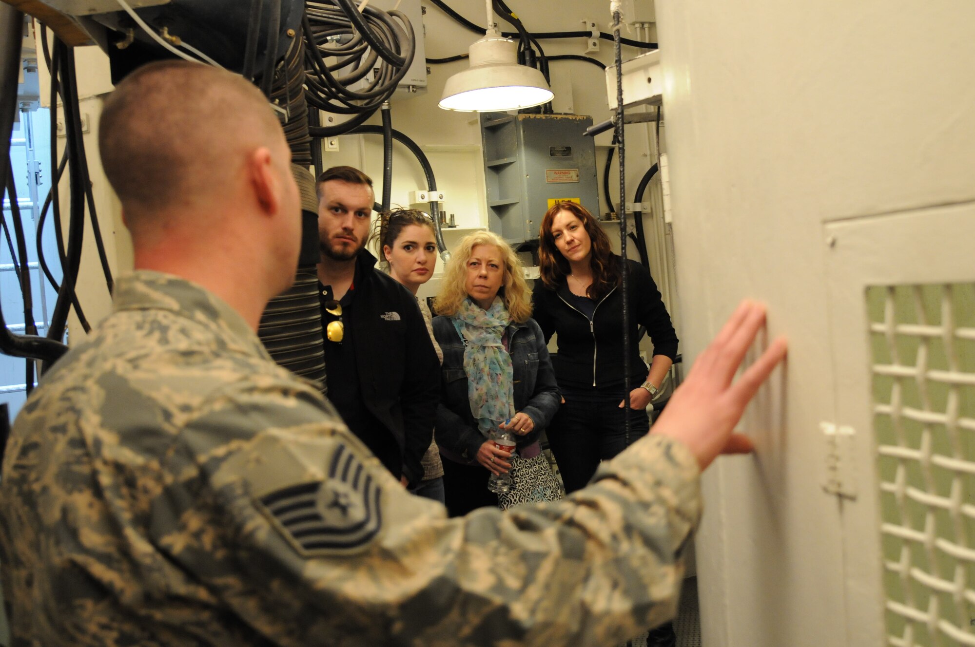 Tech. Sgt. Jeffery Blanda, 90th Missile Maintenance Squadron electro-mechanical team critical task supervisor, provides a tour of the missile maintenance training facility to members of the Leadership Cheyenne Program April 24 on F.E. Warren Air Force Base, Wyo. Leadership Cheyenne is a ten month program ran by the Cheyenne County Chamber designed to create, develop and improve community leaders. The tour took place during the group’s military day to help them develop an understanding for the mission performed by the Airmen stationed here because of Warren’s deep-rooted connection to the Cheyenne community. The group also visited several other locations outside of warren, including the Joint Readiness Center and the Wyoming Air National Guard base. (U.S. Air Force photo by Airman 1st Class Malcolm Mayfield)