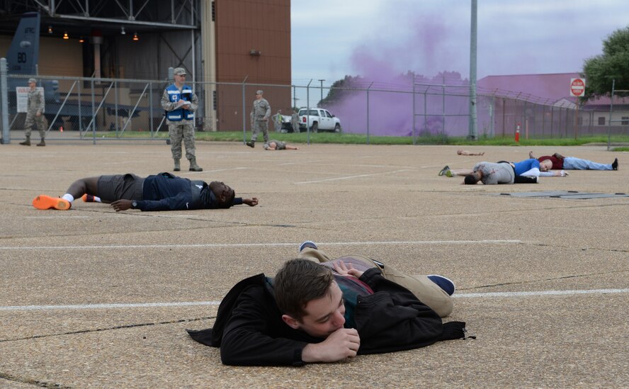 Members of Team Barksdale portray simulated victims during a Major Accident Response Exercise on Barksdale Air Force Base, Louisiana, April 28, 2015. The exercise was held in preparation for any emergencies that may be encountered during an air show, evaluating several base and community emergency services and their level of response. (U.S. Air Force photo/Airman 1st Class Curt Beach)