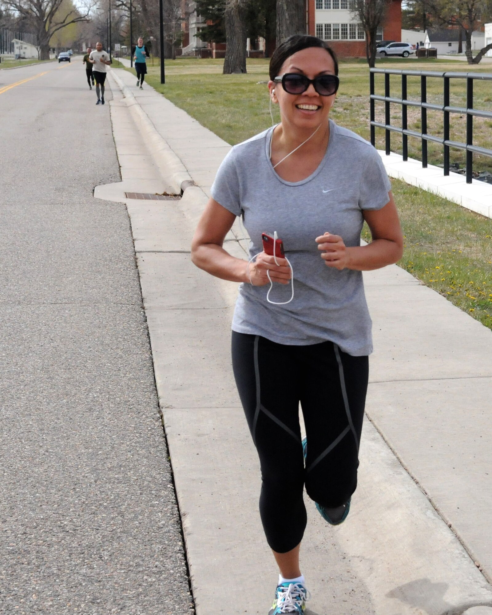 Leslie Gebhardt, 90th Comptrollers Squadron commander, finished the last stretch of the Sexual Assault Prevention and Response Awareness 5k Run on F.E. Warren Air Force Base, Wyo. April 24, 2015. This was the first time the run was held on Warren and the Sexual Assault Response Coordinator office has plans to hold it again next year. (U.S. Air Force photo by Airman 1st Class Malcolm Mayfield)