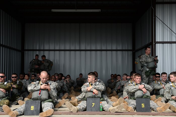 Operation Skyfall 2015 participants wait for their chance to parachute from a UH-60 Black Hawk, 1st Battalion, 171st Aviation Regiment at Plantation Airpark, Sylvania, Ga. March 20, 2015. Operation Skyfall is a joint, multi-lateral combat camera subject matter expert exchange, hosted by the 982nd Combat Camera Company, which takes place at multiple locations in Georgia. Operation Skyfall is an event which focuses on interoperability of combat camera training and capturing airborne operations with three partner nations and multi-service units. (U.S. Air Force photo by Staff Sgt. Nathan Lipscomb/Released)