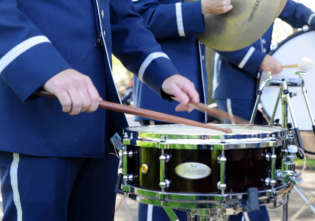 U.S. Air Force Concert Band percussionists play their instruments during a White House Garden Tour Concert in Washington, D.C., April 26, 2015. Two weekends a year, visitors can listen to music while viewing the South Lawn and the gardens of the White House. (U.S. Air Force photo/Airman 1st Class Ryan J. Sonnier)