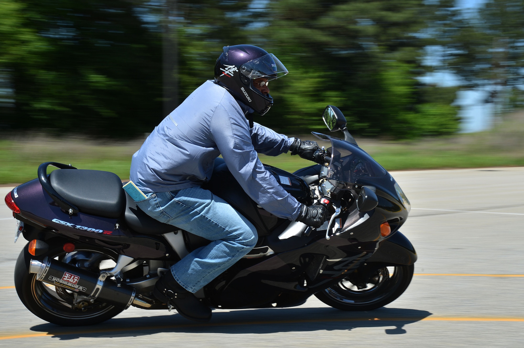 A student of the Rider Coach Preparation Workshop rides around a turn at Shaw Air Force Base, S.C., April 22, 2015. During the seven-day course the students learned and executed motorcycle skills and techniques in preperation to teach mototcycle courses on base. (U.S. Air Force photo by Airman 1st Class Michael Cossaboom/Released)
