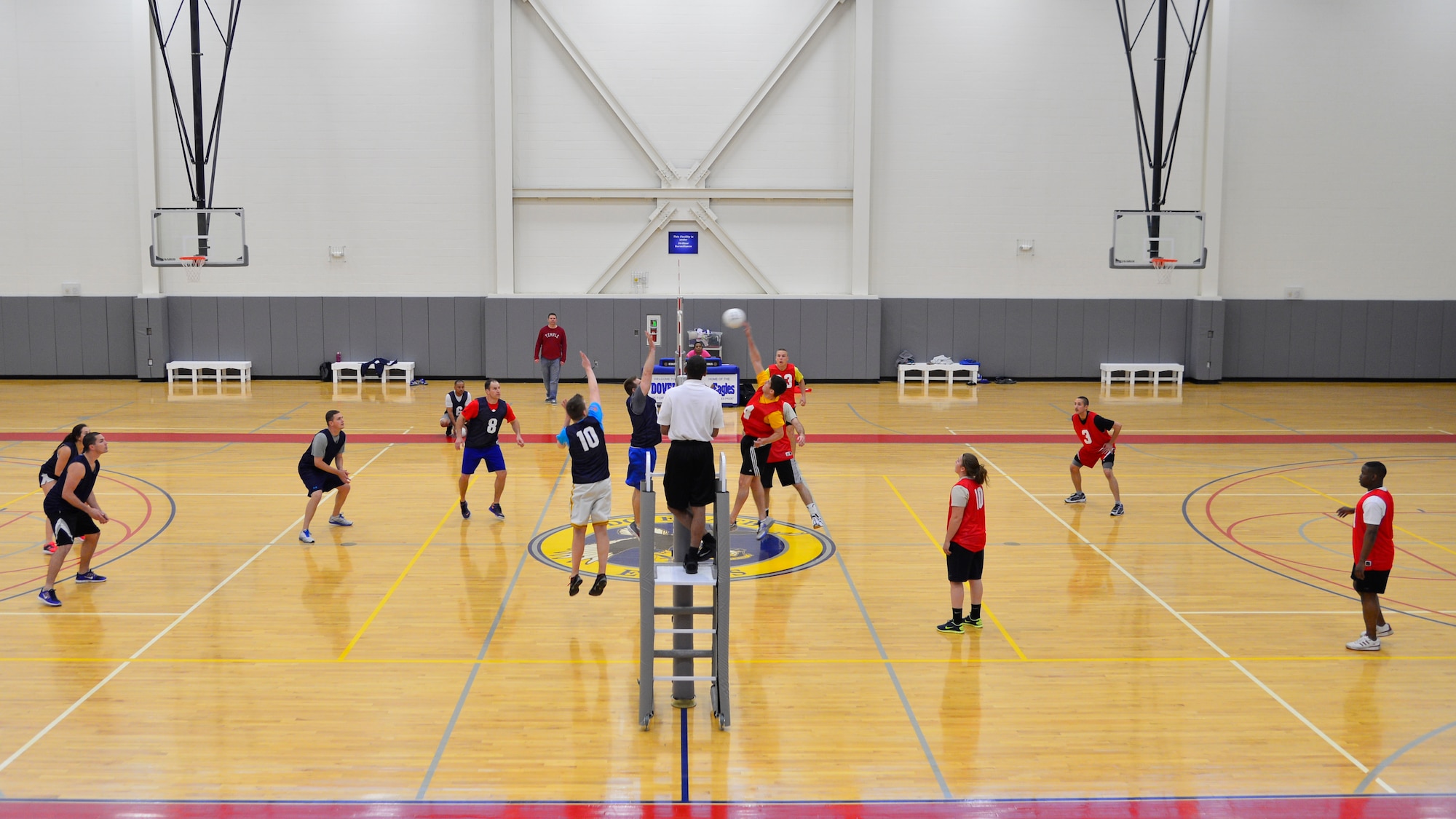 Alexander Precella, 3d Airlift Squadron/436th Operations Support Squadron, spikes a volleyball during an intramural volleyball game against the 9th Airlift Squadron April 23, 2015, at the fitness center on Dover Air Force Base, Del. The 9th AS gained their sixth victory of the season and swept the match 25-18 and 25-23. (U.S. Air Force photo/Airman 1st Class William Johnson)