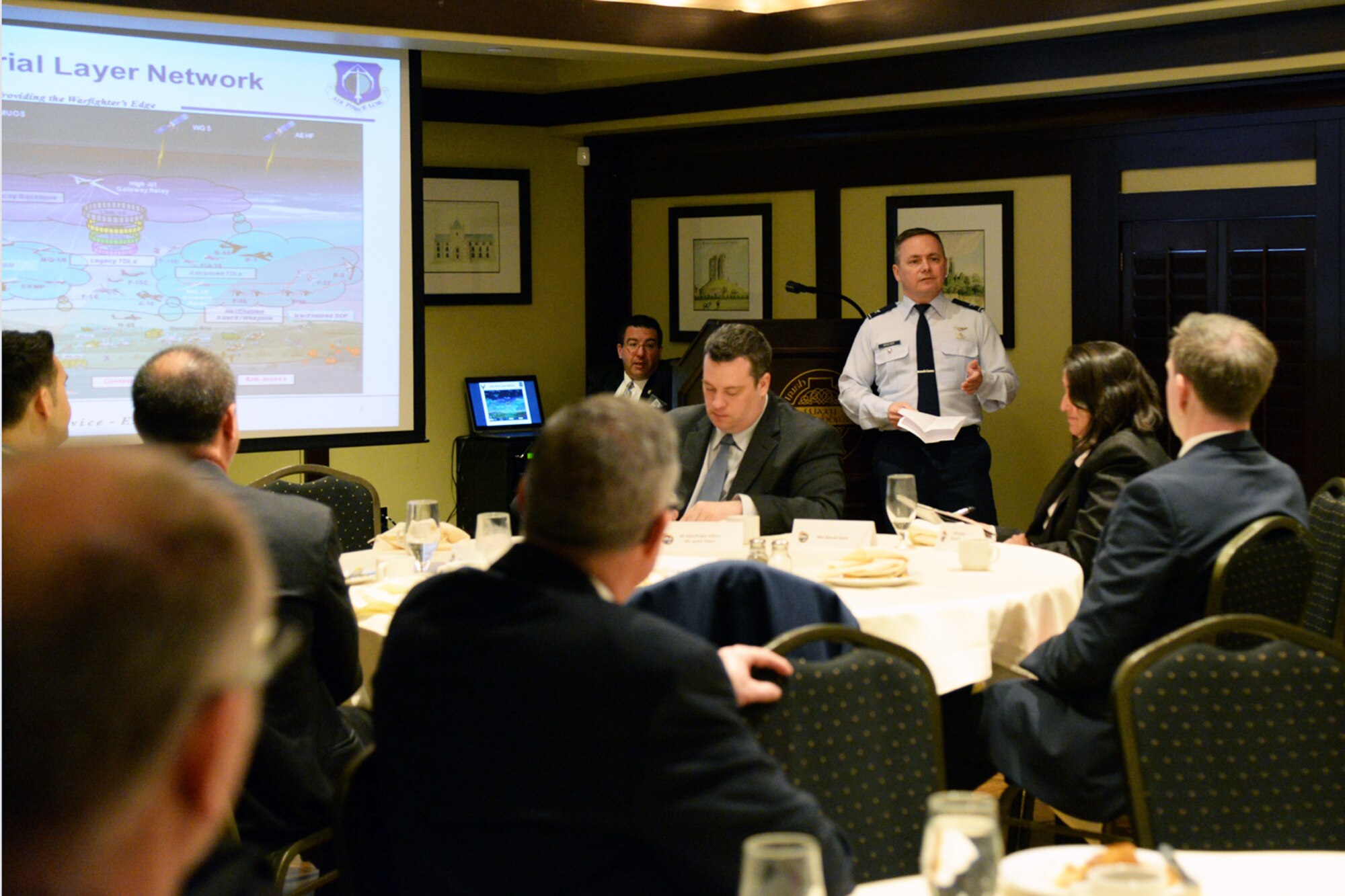 U.S. Air Force Col. Todd Krueger, a Hanscom AFB senior materiel leader, addresses a crowd of industry representatives during a Hanscom Representatives Association meeting in Lexington, Mass., April 28. Topics focused on the mission of the Space, Aerial and Nuclear Networks Division, upcoming contracting opportunities and Air Force cost savings initiatives. (U.S. Air Force photo by Linda LaBonte Britt)