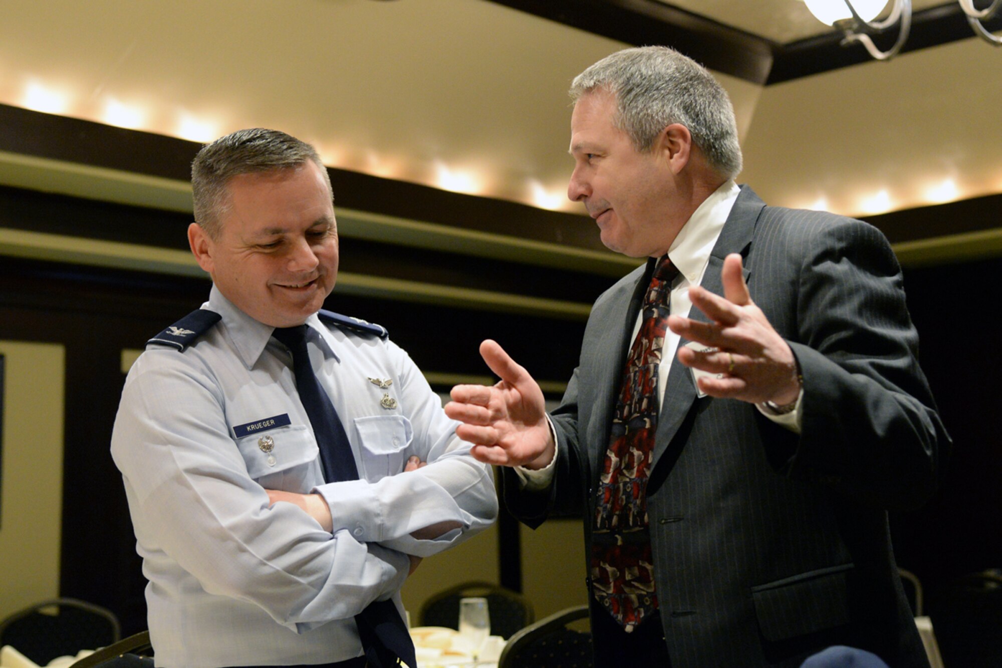 U.S. Air Force Col. Todd Krueger, Space, Aerial and Nuclear Networks Division senior materiel leader, discusses future contracting opportunities with an industry representative during a Hanscom Representatives Association meeting in Lexington, Mass., April 28. Krueger also touched on the Air Force's latest acquisition cost savings initiative, Bending the Cost Curve. (U.S. Air Force photo by Linda LaBonte Britt)