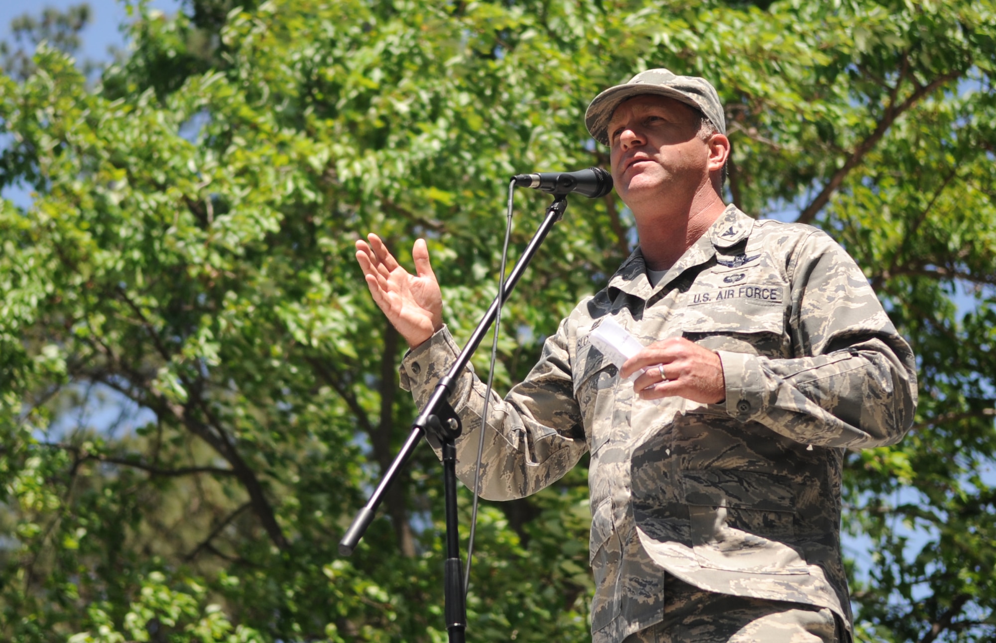 Col. Mark Slocum, 4th Fighter Wing commander, speaks to Airmen from across the base during a commander’s call, April 24, 2015, at Seymour Johnson Air Force Base. Four commander’s calls were held throughout the day as part of a Club Day event where the base clubs showed off their skills and interests. (U.S. Air Force photo/Senior Airman Ashley J. Thum)