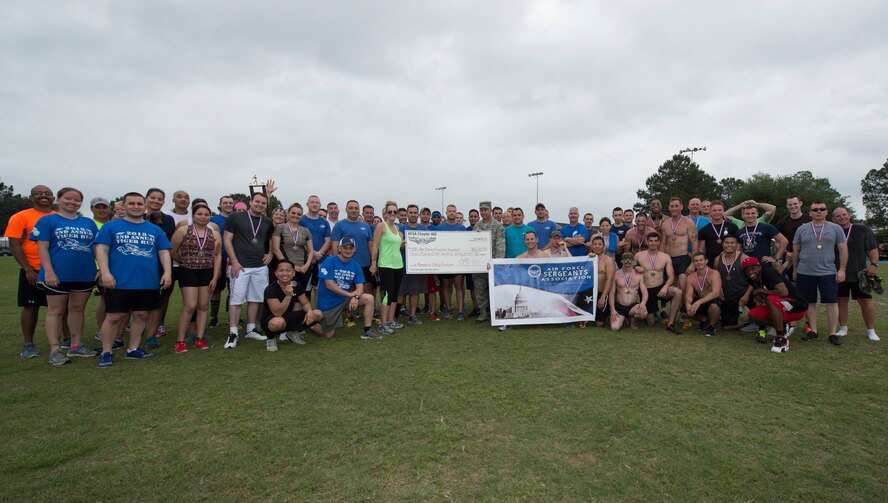 Members from every team that participated in the Air Force Sergeants Association Chapter 460 2nd Annual Tiger Run pose for a picture after collectively running 1,259.25 miles April 25, 2015, at Moody Air Force Base, Ga. AFSA raised more than $3,133 from the run to donate to the Air Force Enlisted Village. (U.S. Air Force photo by Staff Sgt. Eric Summers Jr./ Released)