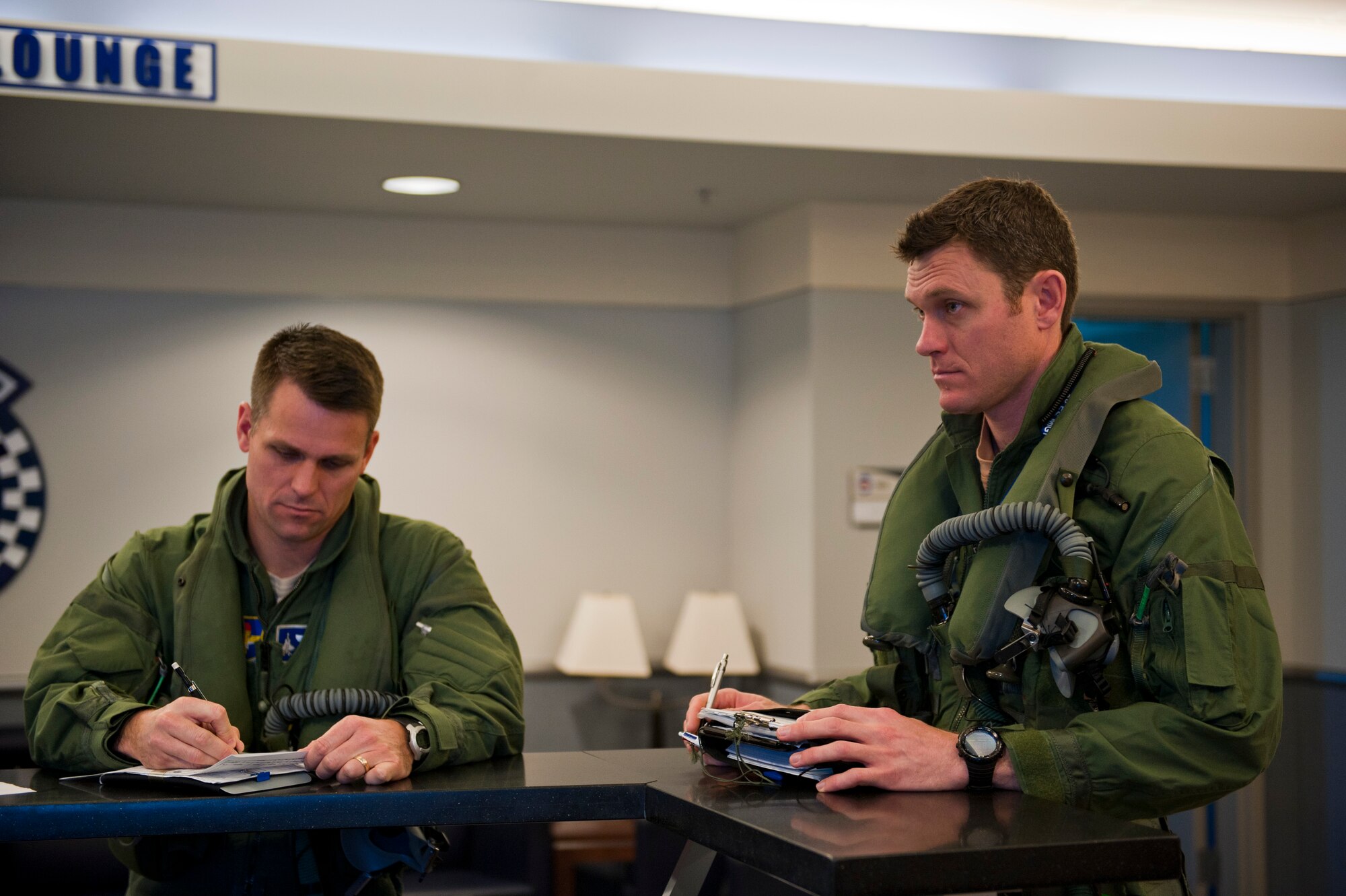 Royal Australian Air Force Squadron Leader Andrew Jackson, F-35 Lightning II student pilot, receives a crew briefing before his final flight, concluding his training on Eglin Air Force Base, Fla., April 23, 2015. Jackson made history as the first Australian pilot to fly in the F-35A. The fifth-generation aircraft will meet Australia’s future air combat and strike needs, providing a networked force-multiplier effect in terms of situational awareness and combat effectiveness. (U.S. Air Force photo/Staff Sgt. Marleah Robertson)