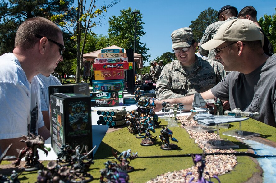 Airmen in the Gaming Club play a round of cards during Club Day, April 24, 2015, at Seymour Johnson Air Force Base, North Carolina. The Gaming Club includes members who enjoy everything from classic board games to fantasy card games. (U.S. Air Force photo/Airman Shawna L. Keyes)