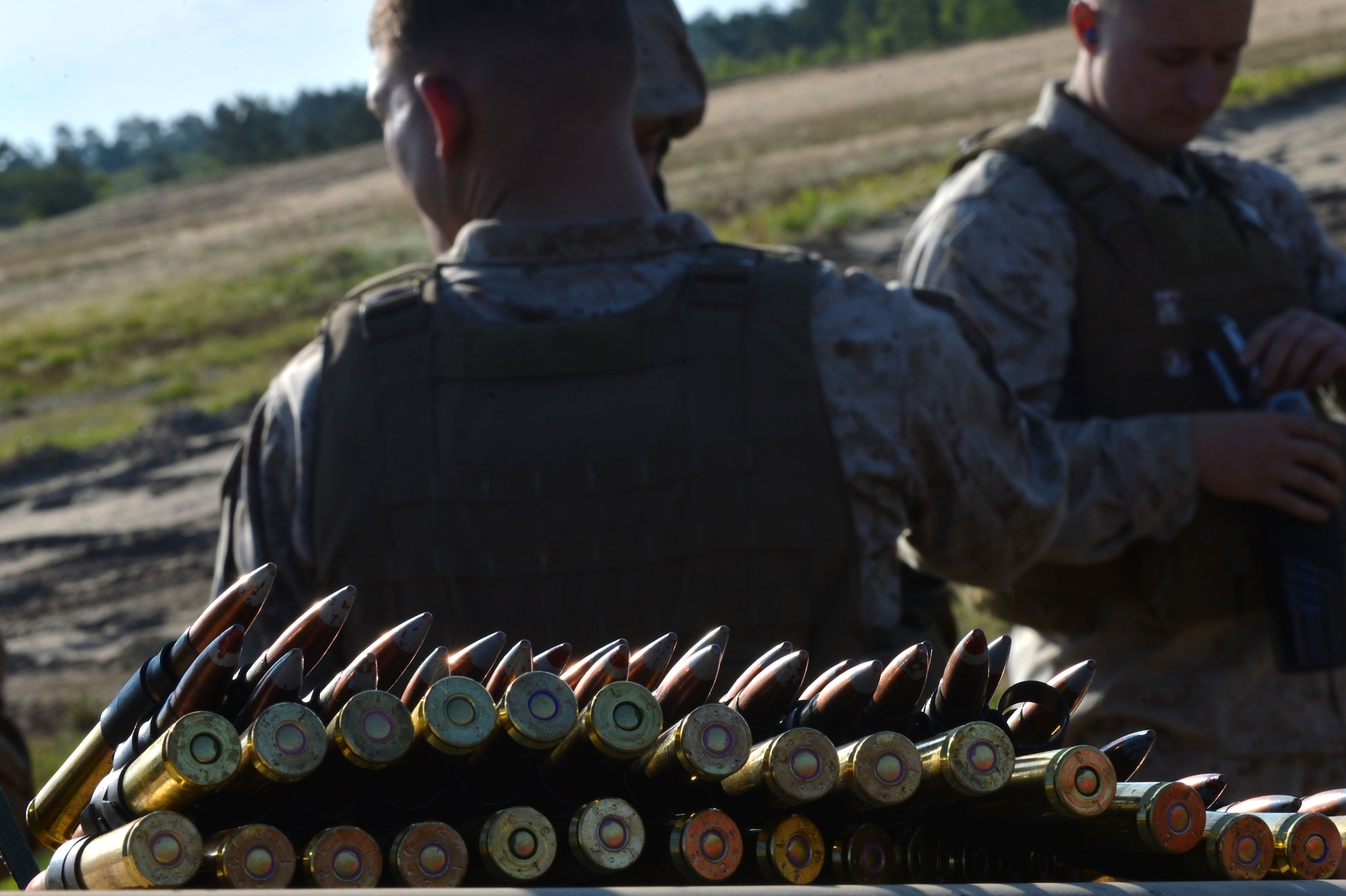Bullets are laid out as U.S. Marines assigned to the Marine Wing Support Squadron 273, Motor Transportation Company, Marine Corps Air Station Beaufort, S.C., review shooting range safety precautions at Poinsett Electronic Combat Range, Wedgefield, S.C., April 23, 2015. The Marines practiced firing both .50 calliber machine guns and 240B machine guns from vehicles. (U.S. Air Force photo by Airman 1st Class Michael Cossaboom/Released)   