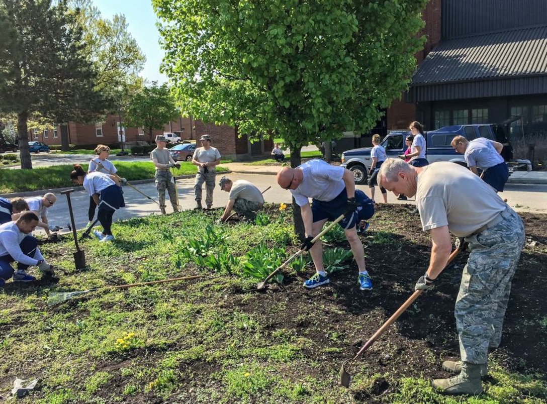 The United States Air Force Band participated in base-wide Earth Day activities by
cleaning up the grounds around Hangar II. (U.S. Air Force Photo/released)

