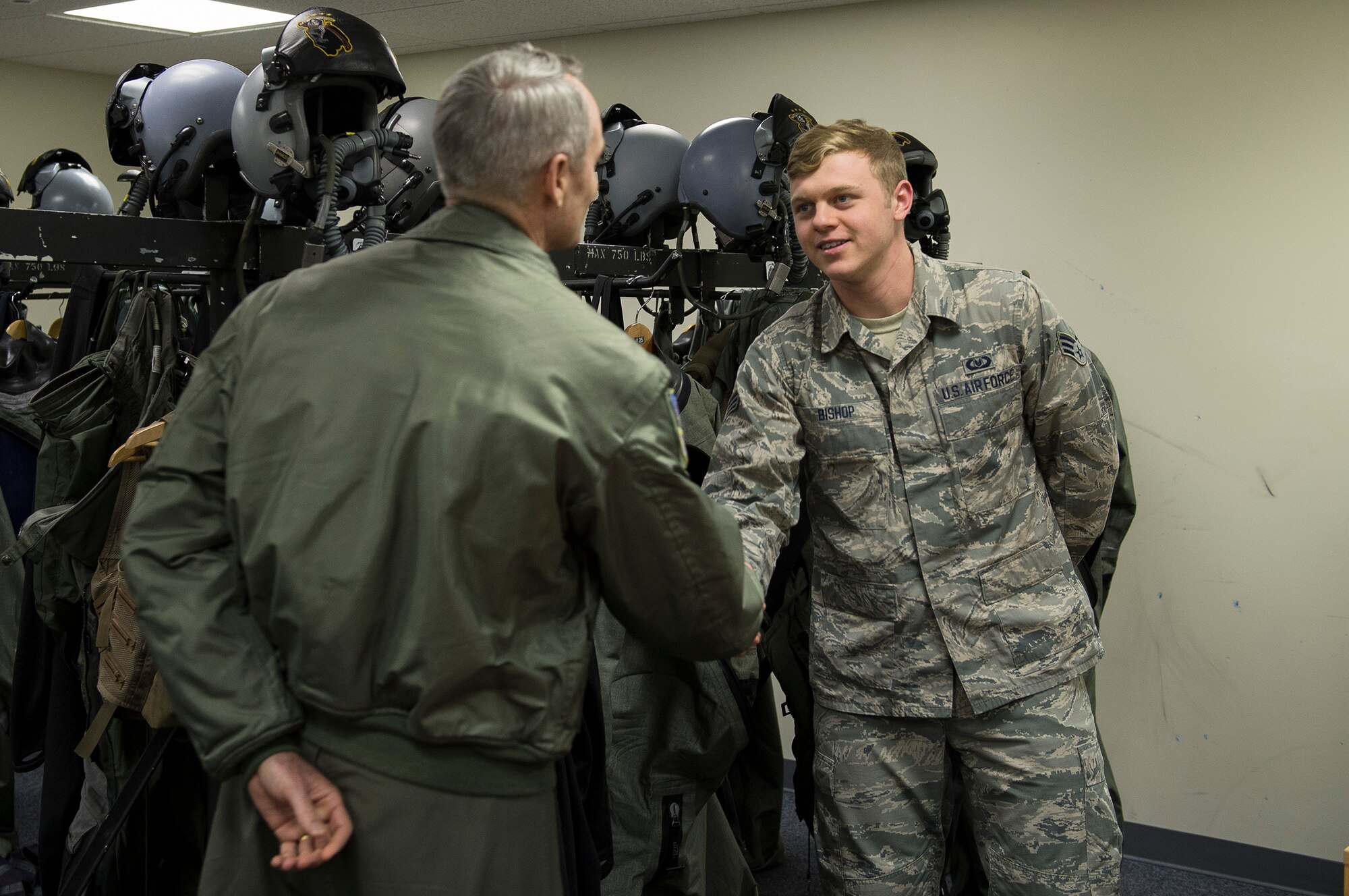 U.S. Air Force Lt. Gen. Darryl Roberson, 3rd Air Force commander, congratulates U.S. Air Force Senior Airman Justin Bishop, 871st Air Expeditionary Squadron aircrew flight equipment, on his recent selection to the Air Force Academy Preparatory School at the Icelandic Air Surveillance and Policing operations center in Keflavik, Iceland,  April 23, 2015. Roberson toured the facilities and spoke with Airmen regarding the IAS mission, an ongoing NATO commitment to maintain the security of Iceland’s airspace. (U.S. Air Force photo by Staff Sgt. Chad Warren/Released)