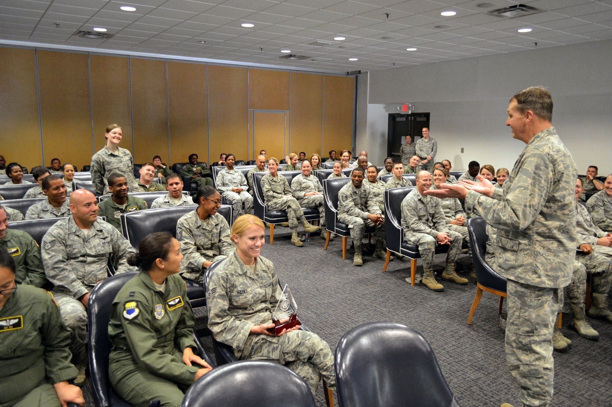 Staff Sgt. Nichole Kilinc, 43rd Aeromedical Evacuation Squadron, asks Brig. Gen. Kory Cornum, Air Mobility Command surgeon, a question during an all call held for 43rd Airlift Group medical Airmen during Cornum’s visit to the 43rd Airlift Group on Apr. 22, Pope Army Airfield, N.C. (U.S. Air Force photo/Marvin Krause)