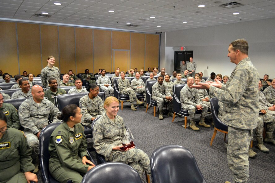Staff Sgt. Nichole Kilinc, 43rd Aeromedical Evacuation Squadron, asks Brig. Gen. Kory Cornum, Air Mobility Command surgeon, a question during an all call held for 43rd Airlift Group medical Airmen during Cornum’s visit to the 43rd Airlift Group on Apr. 22, Pope Army Airfield, N.C. (U.S. Air Force photo/Marvin Krause)