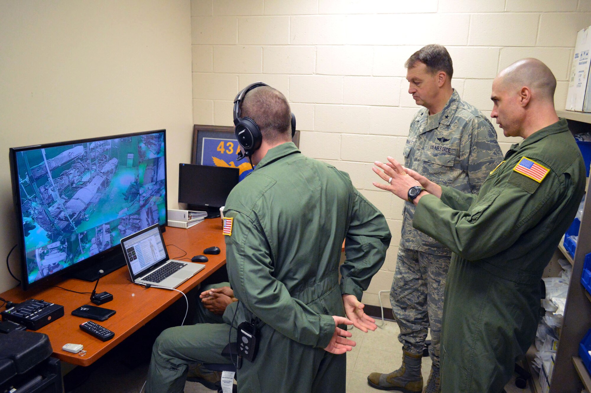 Senior Master Sgt. Phillip Gettins, 43rd Aeromedical Evacuation Squadron superintendent, briefs Brig. Gen. Kory Cornum, Air Mobility Command surgeon, about their unit’s self-help clinical sustainment center simulation laboratory, allowing aeromedical evacuation aircrew members to conduct and receive training credit and certification normally accomplished during in-flight training onboard aircraft. Cornum visited 43rd Airlift Group medical units and Airmen on Apr. 22, Pope Army Airfield, N.C. (U.S. Air Force photo/Marvin Krause)