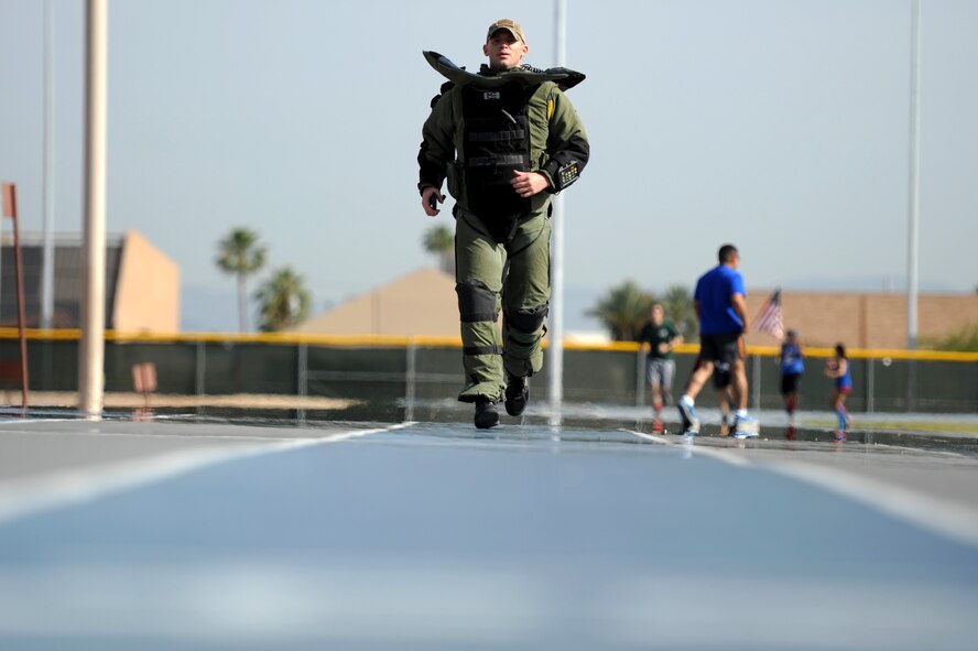 Capt. Ed Spivak, 56th Civil Engineer Squadron Explosive Ordnance Disposal commander, runs in a bomb suit during the challenge. The Viking Challenge is an annual 10-hour-long relay marathon, organized by the Logistics Officer Association, to raise money for the Enlisted Scholarship Fund. (U.S. Air Force photo by Staff Sgt. Staci Miller)