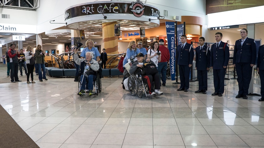 DAYTON, OHIO – Members of the 445th Airlift Wing join other military and local community members at the Dayton International Airport, April 11, 2015 as they salute U.S. military veterans returning from Washington, D.C. More than 800 people were on hand to welcome the vets. The veterans participated in the Honor Flight program which includes a paid trip to Washington, D.C., a visit to each war memorial, and a return flight home.  (U.S. Air Force photo/Senior Airman Devin Long)