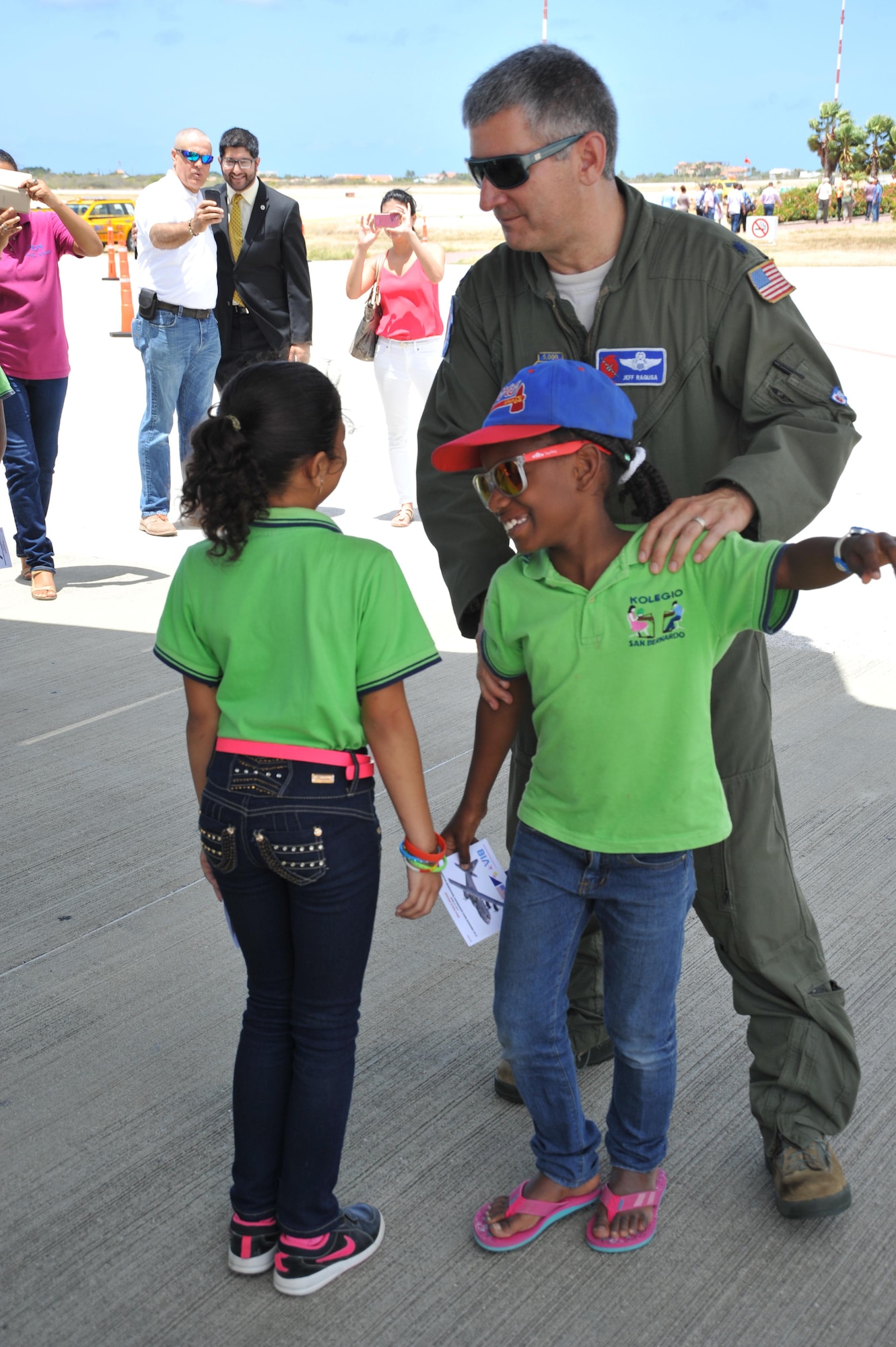 Lt. Col. Jeff Ragusa, 53rd Weather Reconnaissance Squadron pilot, demonstrates to students from Bonaire how the Hurricane Hunters fly through hurricanes and collect weather data for the National Hurricane Center in Miami. More than 1,500 locals toured the WC-130J, which was on display as part of the CHAT April 22, 2015. The outreach program began in the 1970's and is a joint effort between National Oceanic and Atmospheric Administration's National Hurricane Center and the 403rd Wing's 53rd Weather Reconnaissance Squadron. The event promotes hurricane awareness and preparedness throughout the Caribbean region. (U.S. Air Force photo/Maj. Marnee A.C. Losurdo)