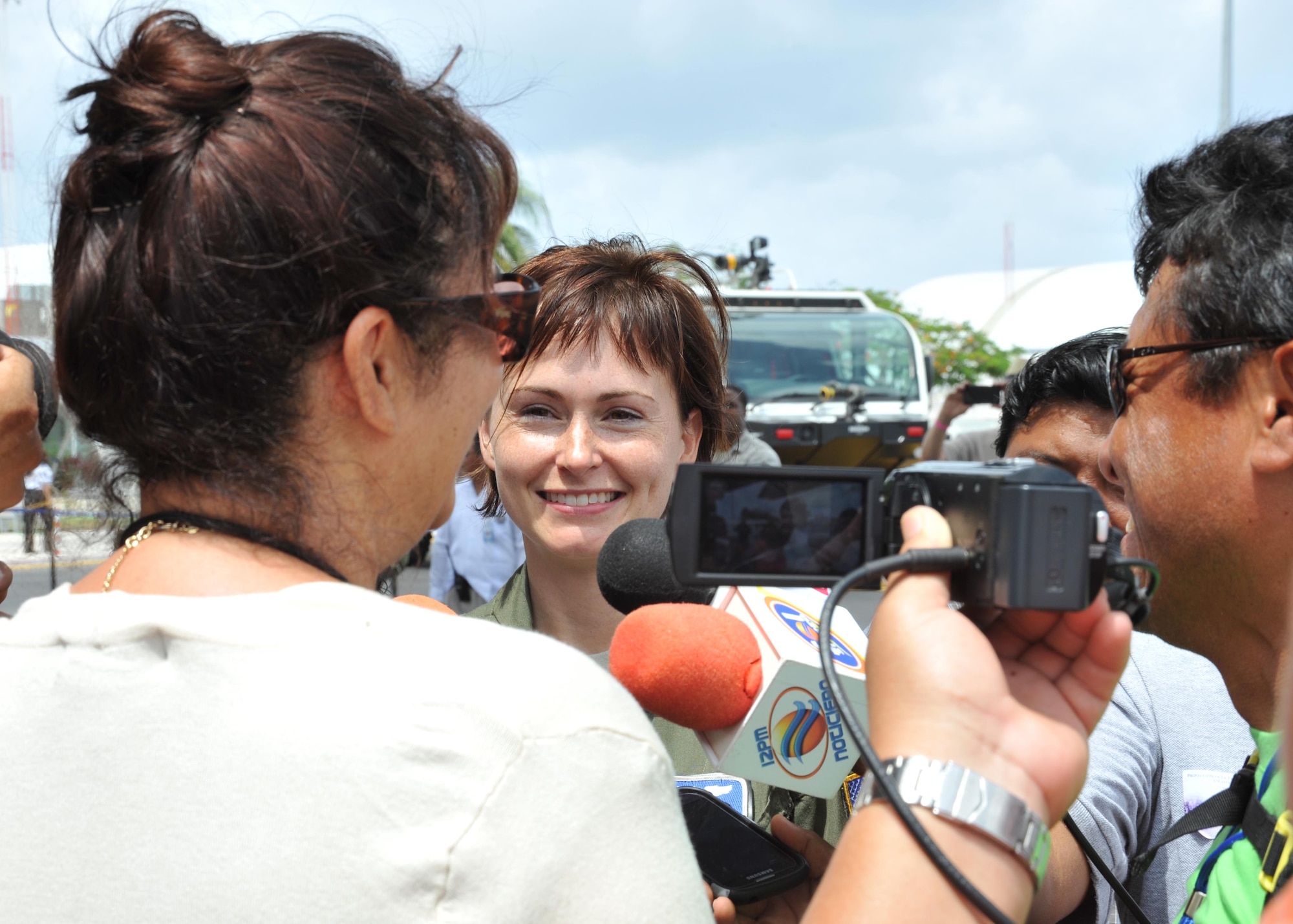 Mexican media interview Maj. Devon Meister, 53rd Weather Reconnaissance Squadron pilot, during the Caribbean Hurricane Awareness Tour at Cozumel, Mexico, April 21, 2015. More than 500 locals toured the WC-130J, which was on display as part of the CHAT. The outreach program, which began in the 1970's and is a joint effort between National Oceanic and Atmospheric Administration's National Hurricane Center and the 403rd Wing's 53rd Weather Reconnaissance Squadron, promotes hurricane awareness and preparedness throughout the Caribbean region. (U.S. Air Force photo/Maj. Marnee A.C. Losurdo)