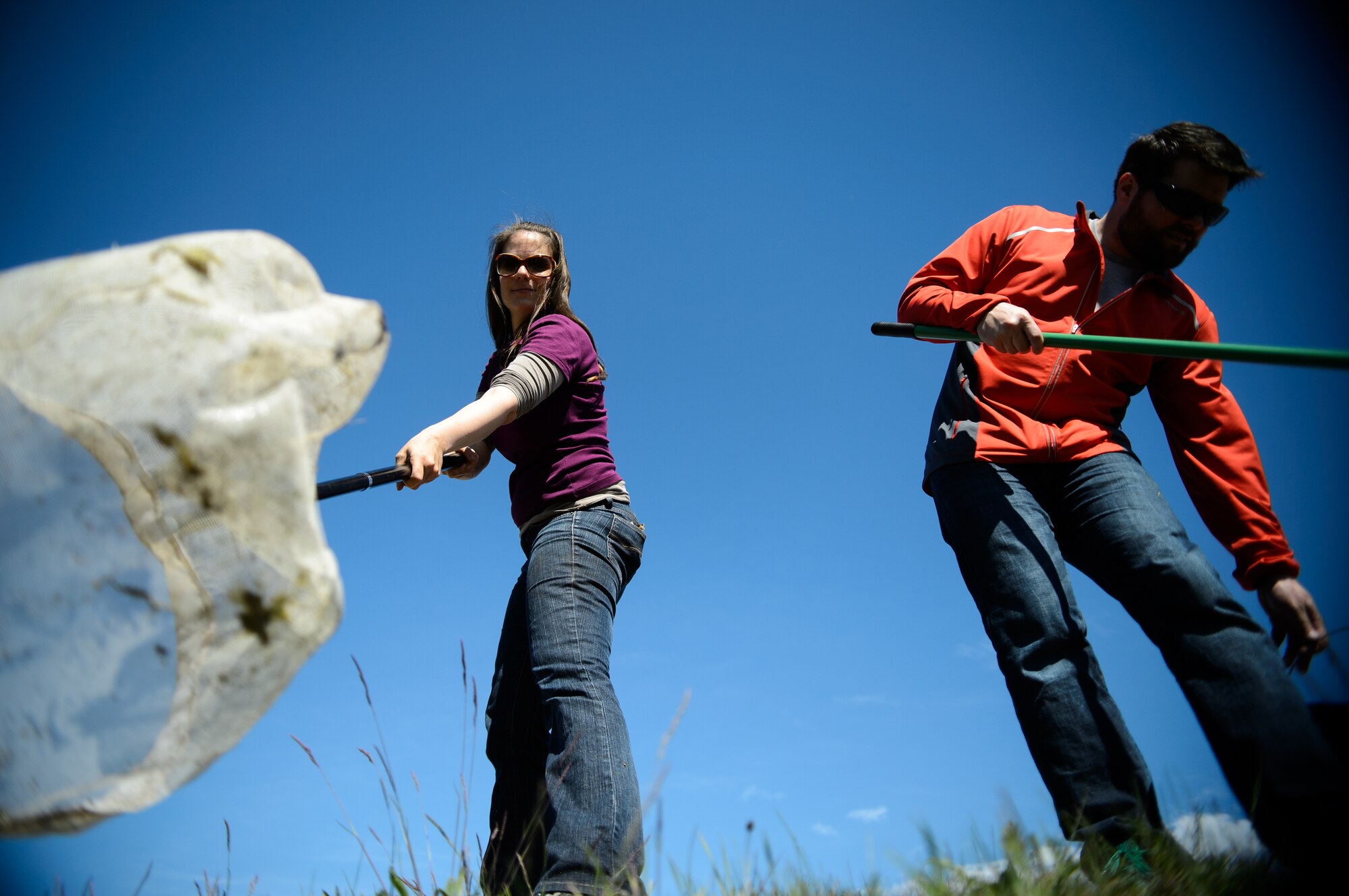 Susanne Panzer, 86th Civil Engineer Squadron natural scientist and biological geographer, and Joashua Lee, 86th CES environmental management intern, begin their search for amphibians near a local wetland April 22, 2015, on Ramstein Air Base, Germany. The 86th CES ensures Ramstein protects the local environment through surveys and cause-and-impact studies on and around the base. (U.S. Air Force photo/Staff Sgt. Armando A. Schwier-Morales)