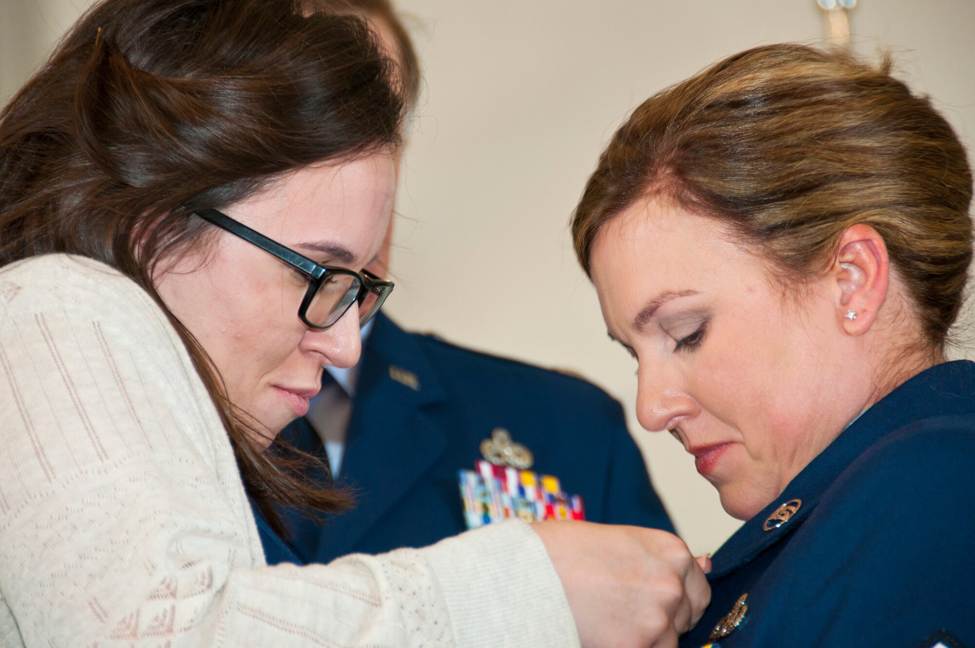 U.S. Air Force Master Sgt. Carolyn Gray, 307th Maintenance Squadron
operations management technician, shows her Meritorious Service Medal to one
of her daughters during her retirement ceremony at Barksdale Air Force Base,
La., April 25, 2015.   Gray, who retired after more than 20 years of
service, thanked her family for all the sacrifices they made during her
career.   During the ceremony, she presented both her daughters with 307th
Bomb Wing coins.  (U.S. Air Force photo by Tech.Sgt. Ted Daigle/Released)