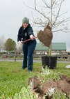 Staff Sgt. Elizabeth Morris, 436th Force Support Squadron First Term Airman Center team leader, digs a hole to plant a new tree during a trail blazing and reforestation event April 25, 2015, at Browns Branch County Park in Harrington, Del. Morris was one of 110 Team Dover volunteers at the event. (U.S. Air Force photo/Airman 1st Class Zachary Cacicia)