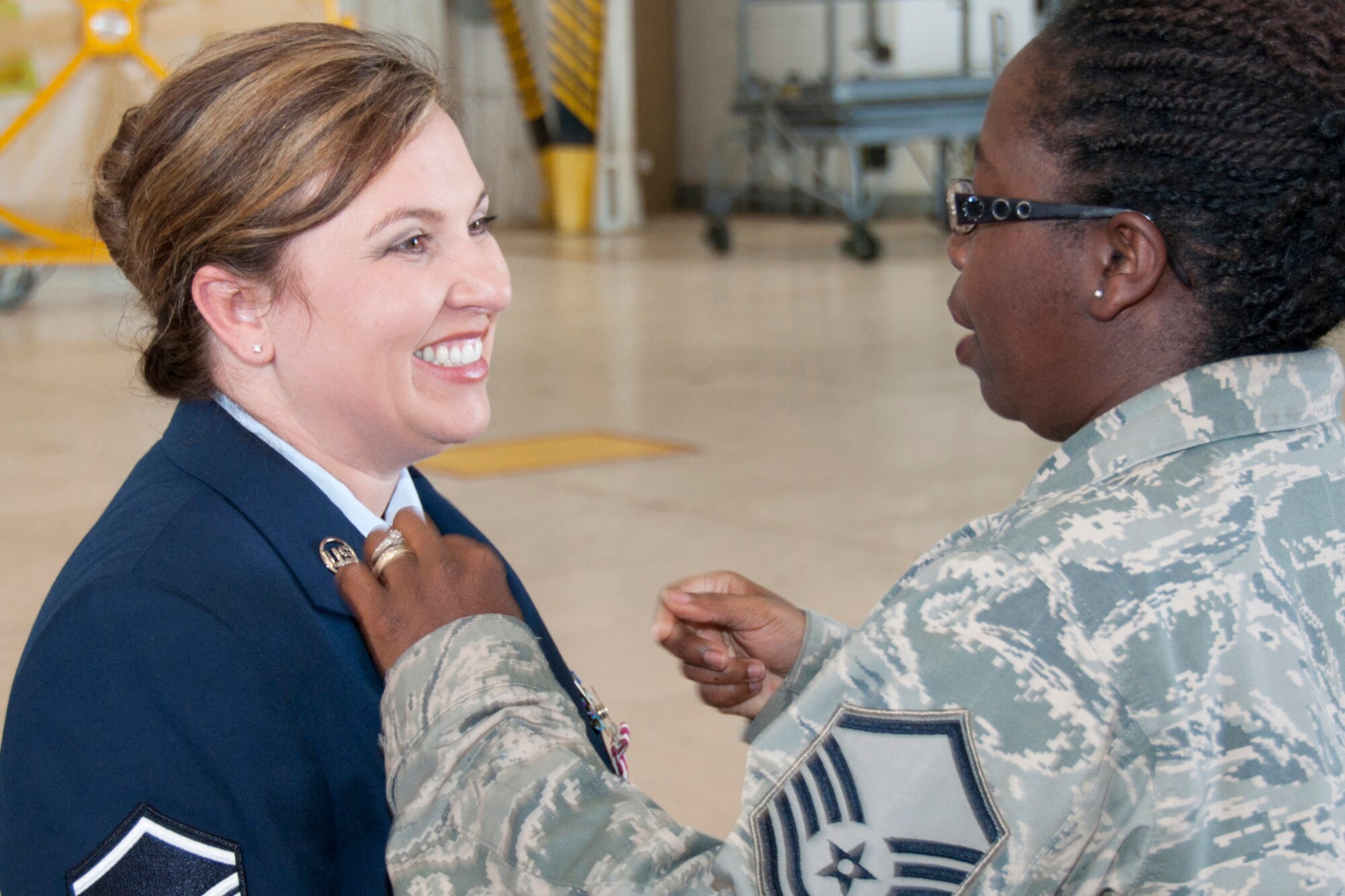 U.S. Air Force Master Sgt. Carolyn Gray, 307th Maintenance Squadron
operations management technician, shares a light moment with a colleague
immediately following her retirement ceremony at Barksdale Air Force Base,
La., April 25, 2015.   A large crowd of family and peers gathered to see
Gray off into the next phase of her life.   She retired with more than 20
years of service.   (U.S. Air Force photo by Tech.Sgt. Ted Daigle/Released)