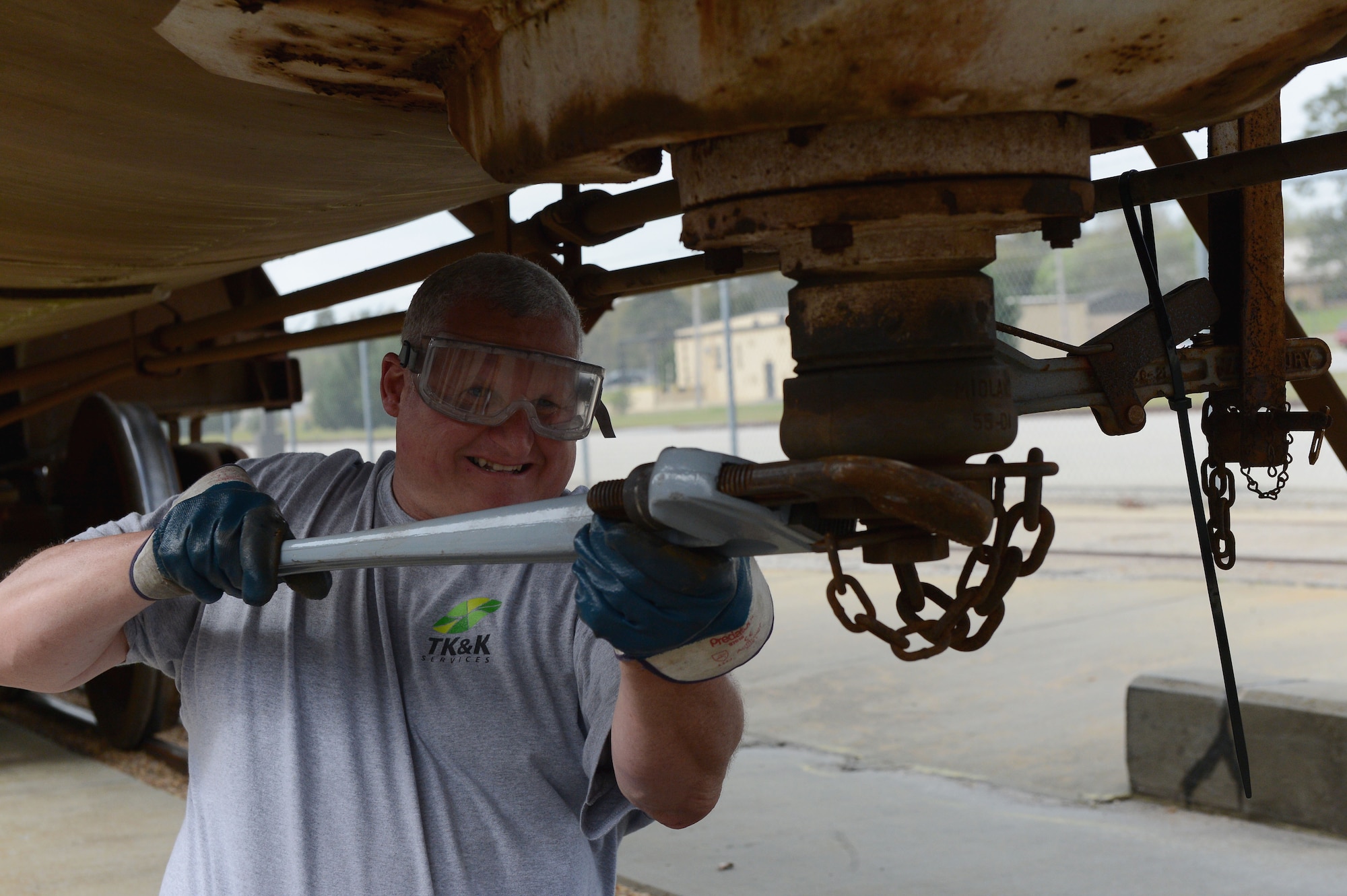 Paul Kipp loosens the main valve on a 20th Logistics Readiness Squadron rail car which carries jet fuel at Shaw Air Force Base, S.C., March 26, 2015. The thousands of gallons of jet fuel in each rail car are transferred underground to holding tanks. (U.S. Air Force photo by Senior Airman Jensen Stidham/Released)