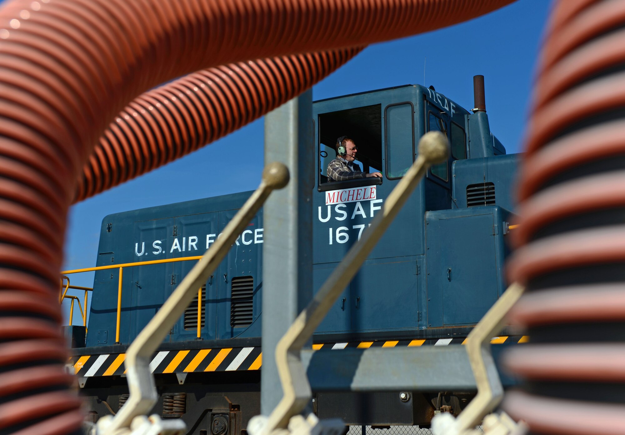 The 20th Logistics Readiness Squadron locomotive engineer waits to offload jet fuel at Shaw Air Force Base, S.C., March 25, 2015. Operating approximately every two weeks, the train is used to pick-up jet fuel located off base. (U.S. Air Force photo by Senior Airman Jensen Stidham/Released)
