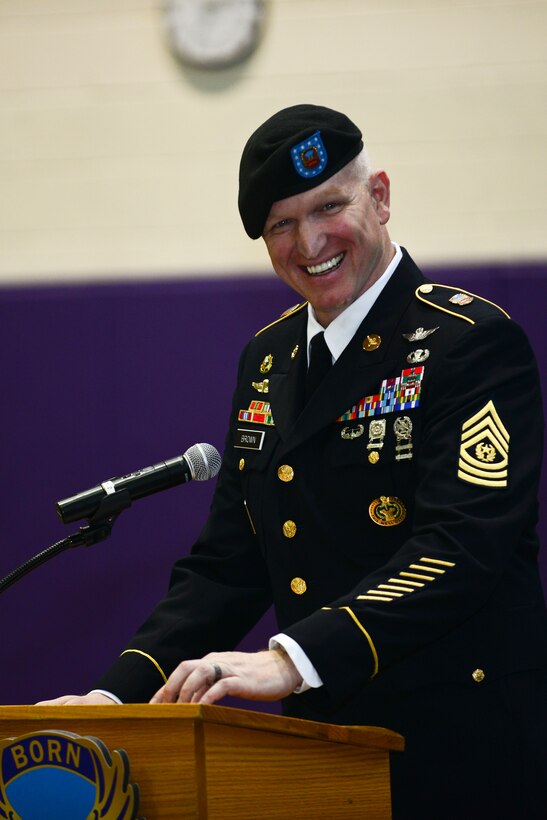 U.S. Army Sgt. Maj. Stanton Brown, 128th Aviation Brigade incoming command sergeant major, laughs during a change of responsibility ceremony at Fort Eustis, Va., April 24, 2015. Brown said it will be an honor to serve with the 128th and hopes to continue to be “Above the Best.”  (U.S. Air Force photo by Senior Airman Kimberly Nagle/Released)  