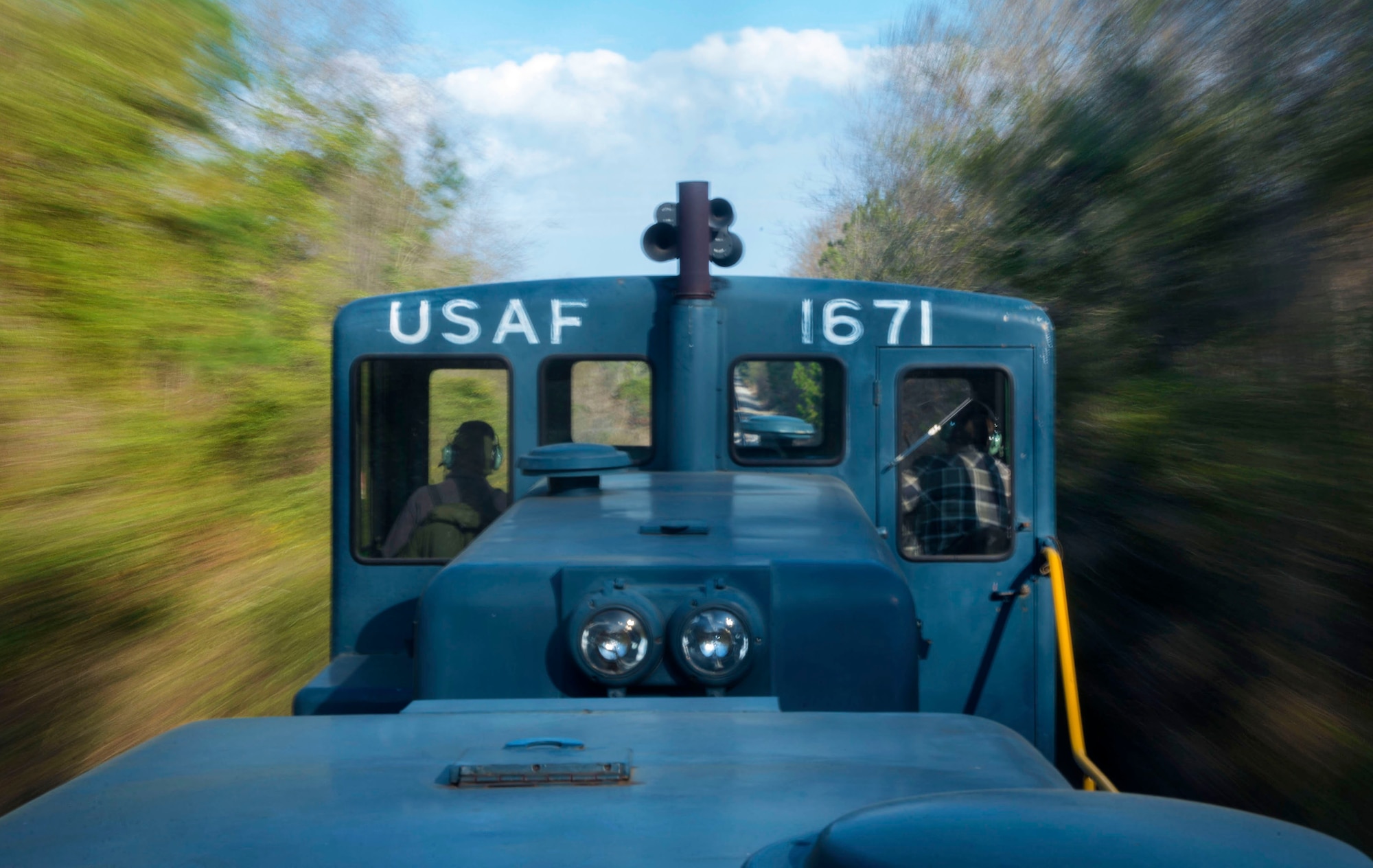 The 20th Logistics Readiness Squadron locomotive races down the tracks on its way back to Shaw Air Force Base, S.C., March 25, 2015. While only moving 20 miles per hour, the several ton train can pull multiple rail cars at a time. (U.S. Air Force photo by Senior Airman Jensen Stidham/Released)