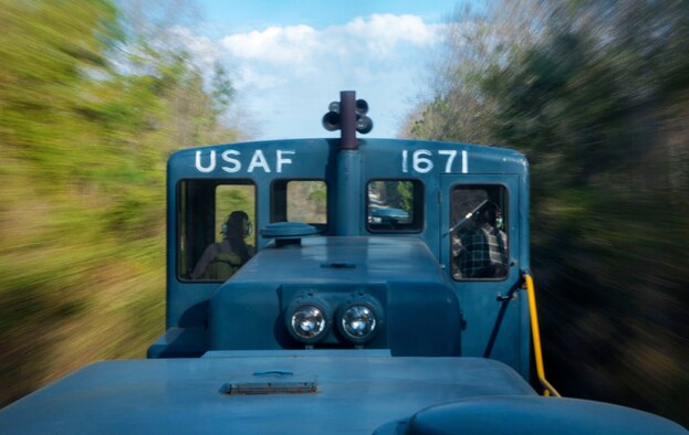 The 20th Logistics Readiness Squadron locomotive races down the tracks on its way back to Shaw Air Force Base, S.C., March 25, 2015. While only moving 20 miles per hour, the several ton train can pull multiple rail cars at a time. (U.S. Air Force photo by Senior Airman Jensen Stidham/Released)