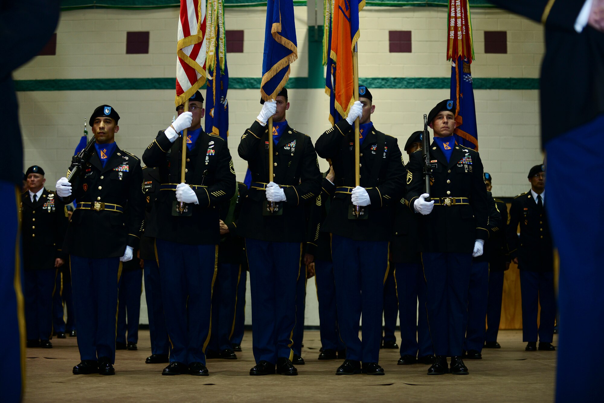 U.S. Army Soldiers from the 128th Aviation Brigade present the colors during a change of responsibility ceremony at Fort Eustis, Va., April 24, 2015. The honor guard held their position throughout the entire ceremony. (U.S. Air Force photo by Senior Airman Kimberly Nagle/Released)  
