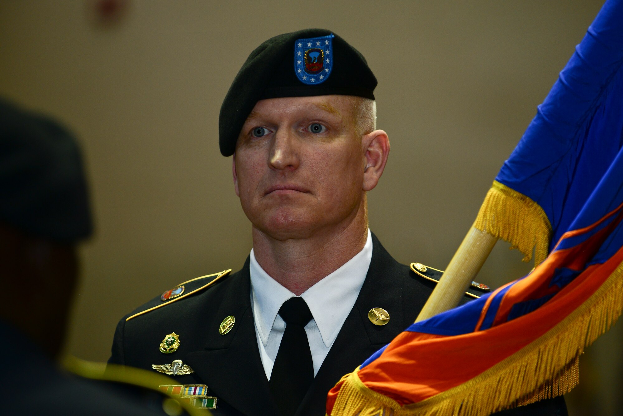 U.S. Army Sgt. Maj. Stanton Brown, 128th Aviation Brigade incoming command sergeant major, accepts responsibility during a change of responsibility ceremony at Fort Eustis, Va., April 24, 2015. Brown accepted responsibility from Sgt. Maj. John Moore, 128th Avn. Bde. outgoing command sergeant major.  (U.S. Air Force photo by Senior Airman Kimberly Nagle/Released)  