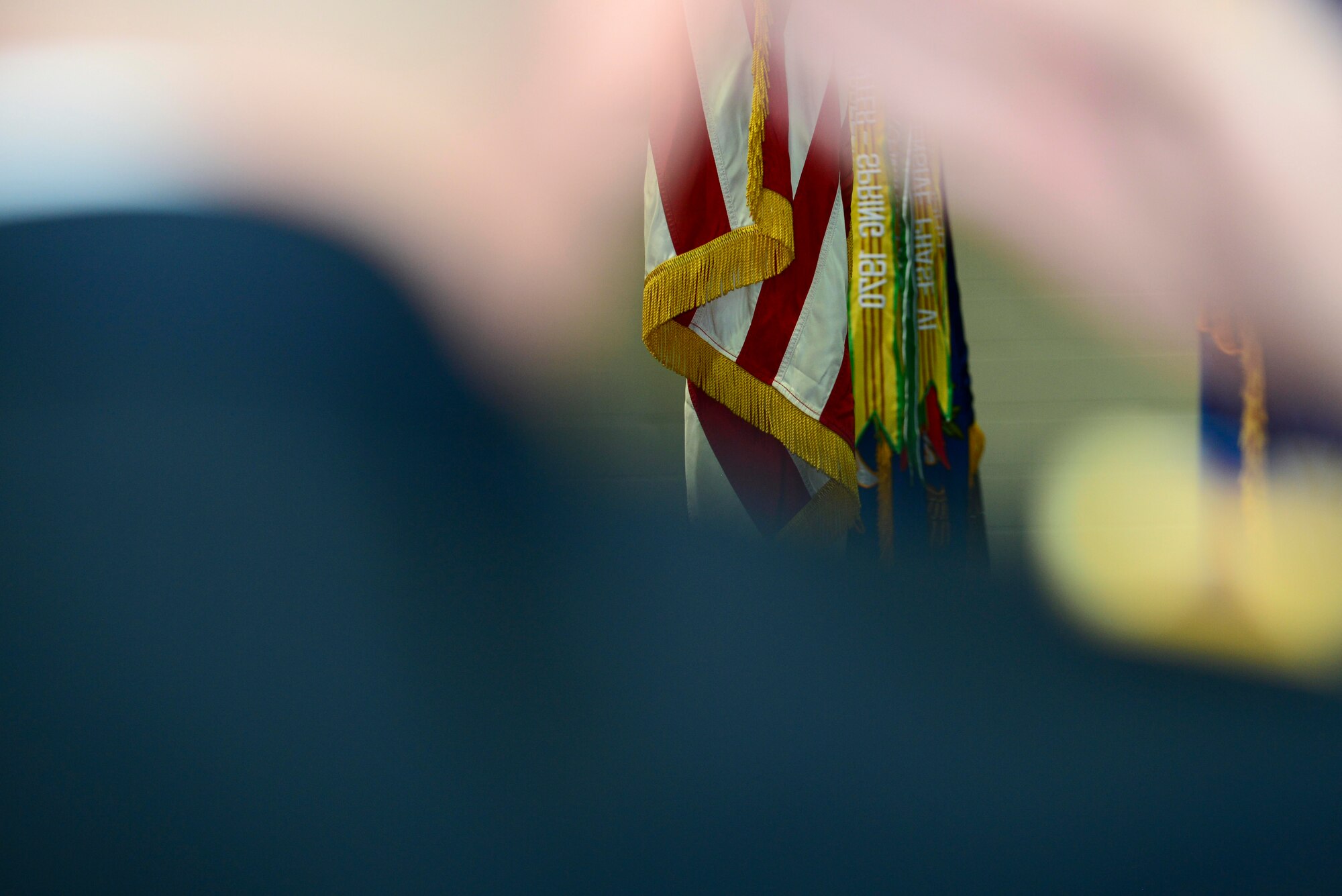 A U.S. Army Soldier salutes the American flag during a change of responsibility ceremony for the 128th Aviation Brigade at Fort Eustis, Va., April 24, 2015. The colors were presented by Soldiers within the 128th Avn. Bde. during the ceremony.  (U.S. Air Force photo by Senior Airman Kimberly Nagle/Released)  