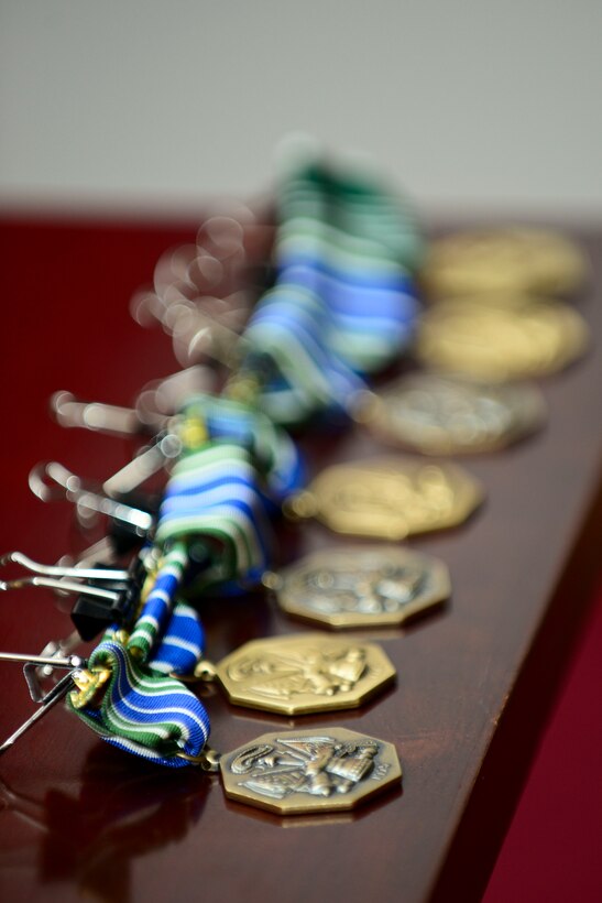 Army Achievement Medals are displayed to be presented to U.S. Service members from the Joint Base Langley-Eustis Culinary Arts Team for their work at the 40th Annual Military Culinary Arts Competition, at Fort Eustis, Va., April 27, 2015. The team consisted of nine U.S. Army Soldiers and U.S. Air Force Airmen. (U.S. Air Force photo by Senior Airman Kimberly Nagle/Released)