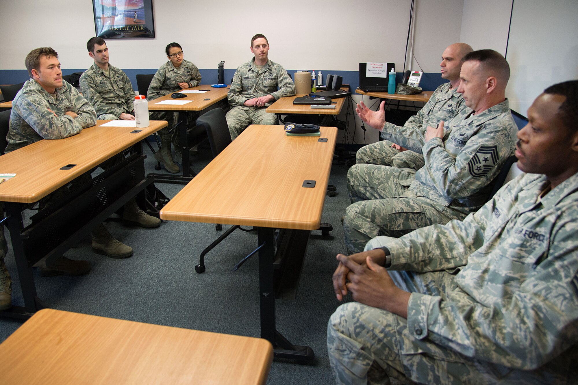 Command Chief Master Sgt. Craig Poling (center) speaks to first term lieutenants during the Lieutenant Professional Development Program at the Education and Training Center April 23. Also participating in the panel discussion is Chief Master Sgt. Gerald Nunes Jr. (left), 66th Security Forces Squadron superintendent and Chief Master Sgt. Omar Hardman, 66th Medical Squadron superintendent. In addition to the senior NCO mentoring session, the lieutenants heard from base senior leaders, received briefings and learned more about the installation. (U.S. Air Force photo by Mark Herlihy)