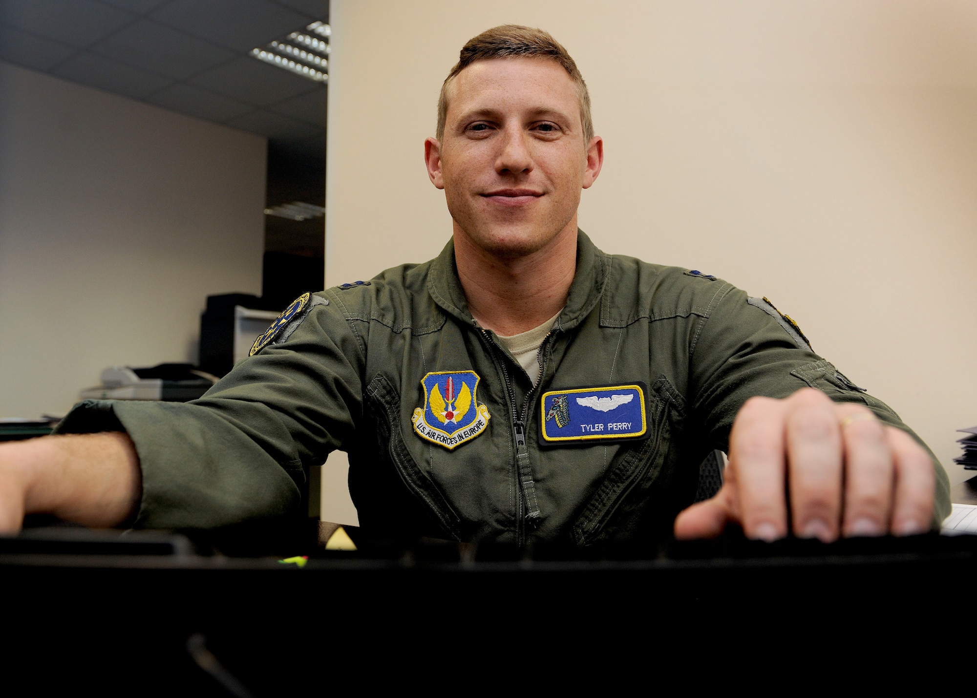 Capt. Tyler Perry, 39th Air Base Wing executive officer, works at his desk April 21, 2015, at Incirlik Air Base, Turkey. Perry was nominated as the U.S. Air Forces in Europe - U.S. Air Forces Africa for the Airlift/Tanker Association Young Leadership Awards and will go on to compete at the Air Force-level. (U.S. Air Force photo by Senior Airman Krystal Ardrey/Released)
