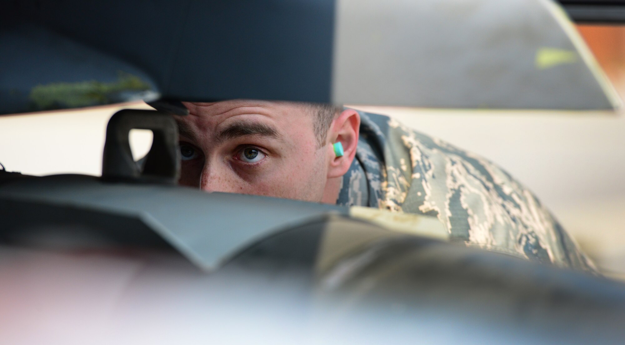 Staff Sgt.  Sudhish Sariano from the 36th Aircraft Maintenance Unit guides the uploading of practice munitions during the quarterly load competition held at Osan Air Base, Republic of Korea, 10 April 2015. The competition adds an element of fun to what is really a qualification test for the technicians wherein they must complete a written test as well as a practical demonstration of skill.
(USAF photo by Staff Sgt. Amber Grimm)