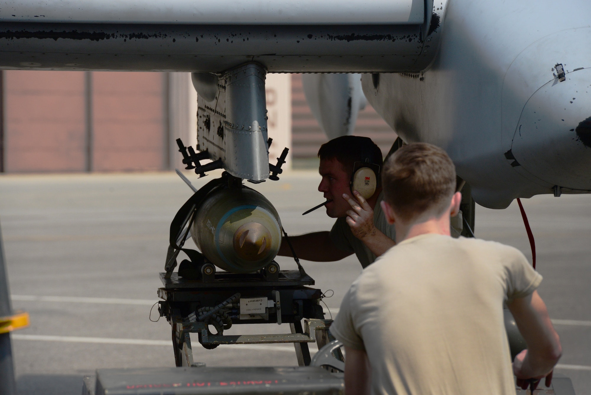 Staff Sgt. Christopher Simison of the 25th Aircraft Maintenance Unit directs the loading of practice munitions during the quarterly load competition held at Osan Air Base, Republic of Korea, 10 April 2015. The competition adds an element of fun to what is really a qualification test for the technicians wherein they must complete a written test as well as a practical demonstration of skill.
(USAF photo by Staff Sgt. Amber Grimm)