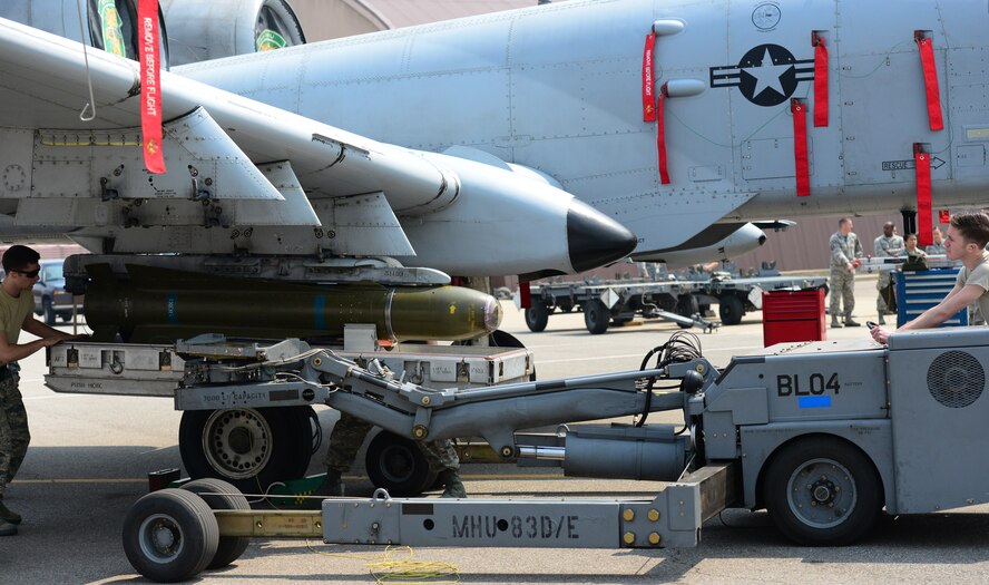 Senior Airmen Brandon Hanie and Ryan Reichard of the 25th Aircraft Maintenance Unit carefully work to affix a simulated combat load to an A-10 during the quarterly load competition held at Osan Air Base, Republic of Korea, 10 April 2015. The competition adds an element of fun to what is really a qualification test for the technicians wherein they must complete a written test as well as a practical demonstration of skill.
(USAF photo by Staff Sgt. Amber Grimm)