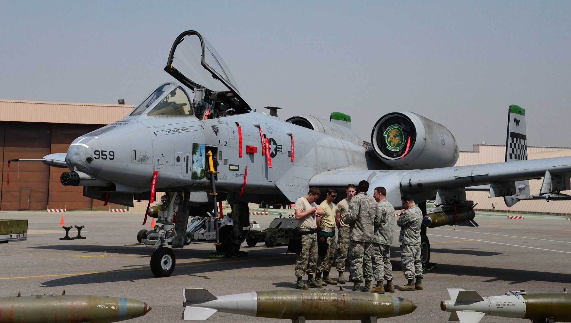 Staff Sgt. Christopher Simison and Senior Airmen Brandon Hanie and Ryan Reichard from the 25th Aircraft Maintenance Unit standby for the commencement of the Quarterly Weapons Load competition held at Osan Air Base, Republic of Korea, 10 April 2015. The competition adds an element of fun to what is really a qualification test for the technicians wherein they must complete a written test as well as a practical demonstration of skill. 
(USAF photo by Staff Sgt. Amber Grimm)