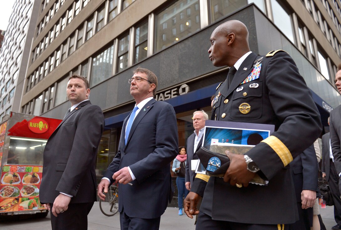 Defense Secretary Ash Carter, center, walks with Maj. Gen. Ronald F. Lewis between meetings in New York City, April 27, 2015. 