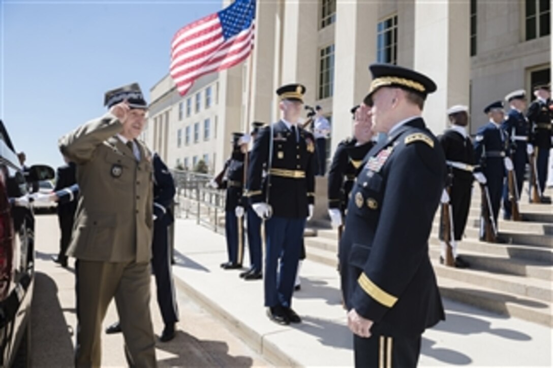 U.S. Army Gen. Martin E. Dempsey, right, chairman of the Joint Chiefs of Staff, welcomes Polish Army Gen. Mieczyslaw Gocul, chief of the general staff of Poland's armed forces, to the Pentagon, April 28, 2015. During the visit, the two leaders discussed matters of mutual importance and Dempsey presented Mieczslaw with the U.S. Legion of Merit award.