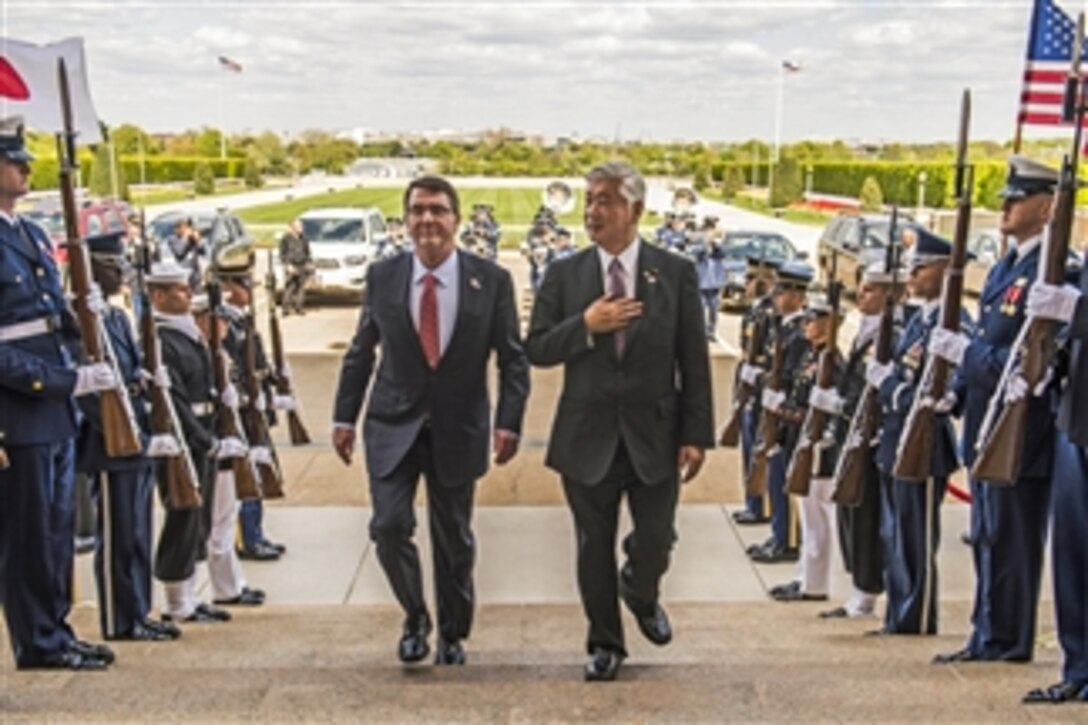 U.S. Defense Secretary Ash Carter, left, hosts an enhanced honor cordon for Japanese Defense Minister Gen Nakatani as he arrives at the Pentagon, April 28, 2015, to discuss matters of mutual importance.